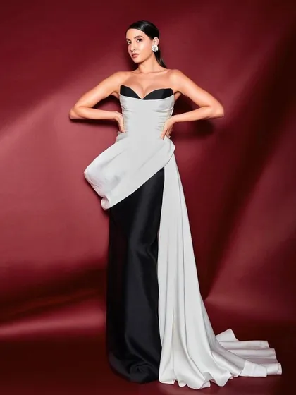 I styled Nora Fatehi in this elegant black and white sculpted gown by Mark Bumgarner. The look is a study in contrasts, combining a classic color palette with a modern, architectural silhouette for a sophisticated awards night appearance.