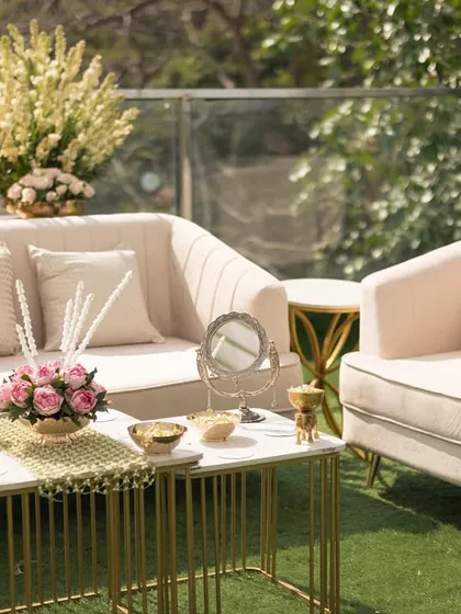 A comfortable and stylish lounge seating area for guests, complete with plush cushions and elegant floral arrangements.