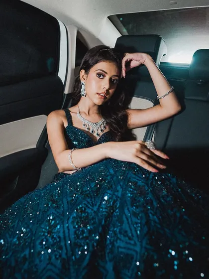 Your wedding events are a chance to play with different styles. Here’s a chic and modern look perfect for a cocktail or engagement night, featuring a bold smokey eye and a glossy nude lip that’s ready for the party.