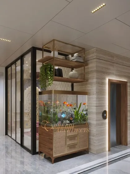 This hallway design cleverly incorporates a custom aquarium and shelving unit next to the elevator, blending nature and storage into the architecture.