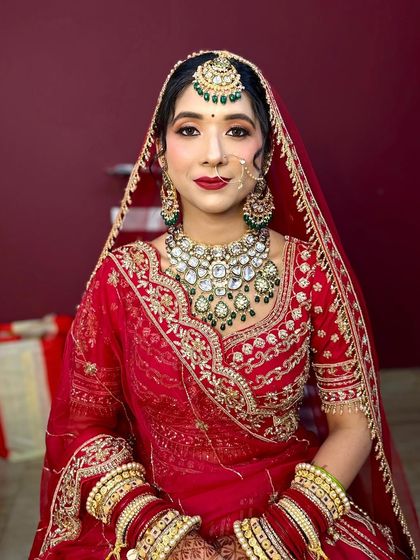 She wanted a soft look, and that's what I gave her. A flawless base, soft eyes, and a classic red lip.