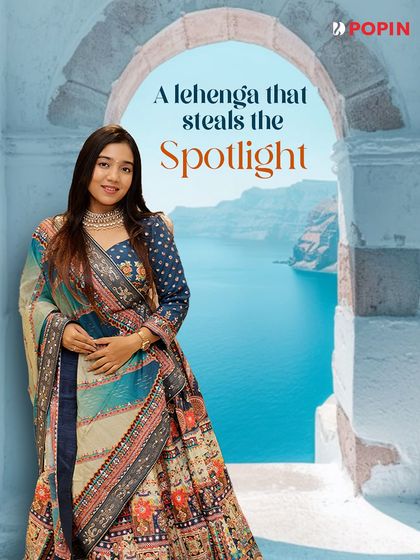 A lehenga that steals the spotlight. This graphic places the stunning blue printed lehenga in a dreamy, aspirational setting.