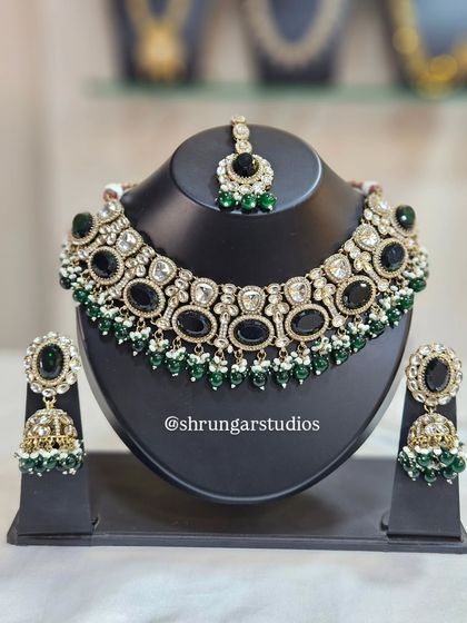 A bold and beautiful AD set with large black stones and green beads, perfect for making a statement.
