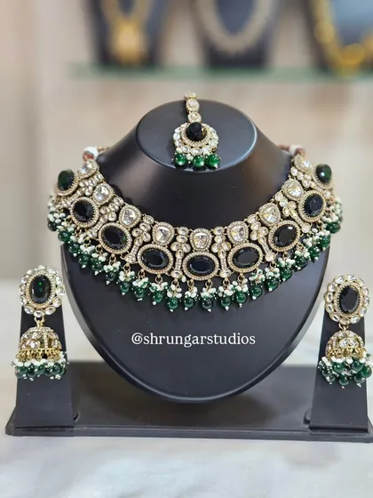 A bold and beautiful AD set with large black stones and green beads, perfect for making a statement.