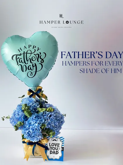 This Father's Day hamper comes in shades of blue, featuring a beautiful arrangement of hydrangeas and a "Happy Father's Day" balloon. It's a fresh and elegant way to show your love.