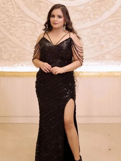 The full view of this chic cocktail dress. The makeup is kept sophisticated to balance the sparkle of the gown.