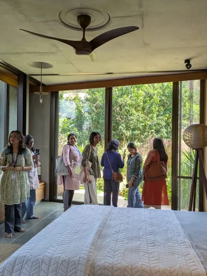 Students exploring one of the bedrooms at Villa Soham. The floor-to-ceiling windows were designed to dissolve the boundary with the outdoors, a key principle that the students could experience firsthand.