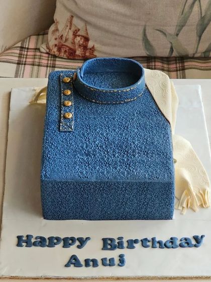 A uniquely textured cake designed to look like a denim kurta, perfect for a stylish and personalized birthday celebration.