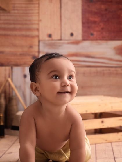 The bright, happy smile of a baby is the best thing to capture. This little cowboy is full of joy.