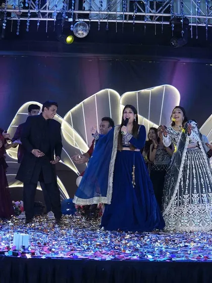 The entire family joins in for a group performance. My role as an emcee is to guide these moments and ensure everyone on stage has a fantastic time.
