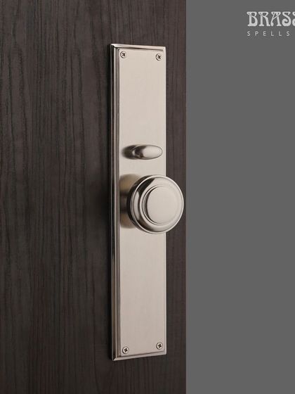 The interior side of the Emperor Entrance Set, featuring a simple, elegant knob in a matching Brush Nickel finish. This ensures a consistent and refined look from every angle.