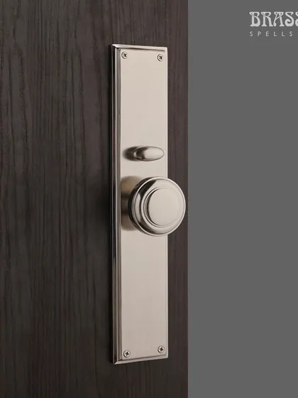 The interior side of the Emperor Entrance Set, featuring a simple, elegant knob in a matching Brush Nickel finish. This ensures a consistent and refined look from every angle.