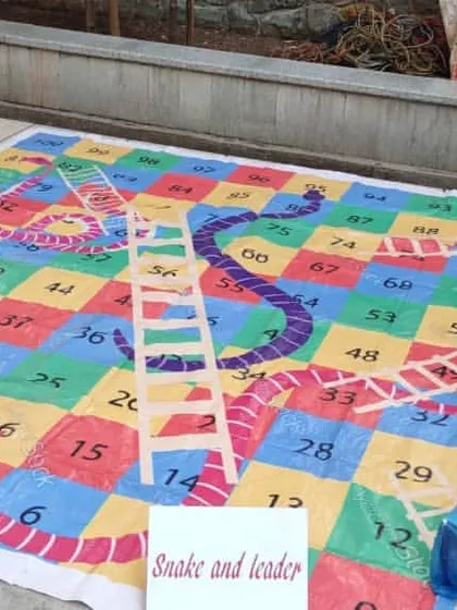 I offer a giant snakes and ladders mat that turns the board game into a life-sized interactive experience. Players can walk on the board and act as their own game pieces.