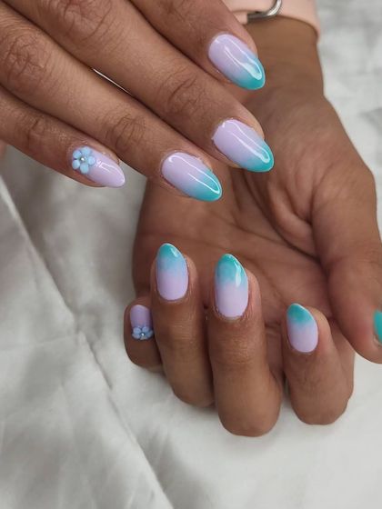 Perfect vacation nails. This set features a beautiful ombre from lavender to teal, with small, delicate 3D flowers on the accent nails.
