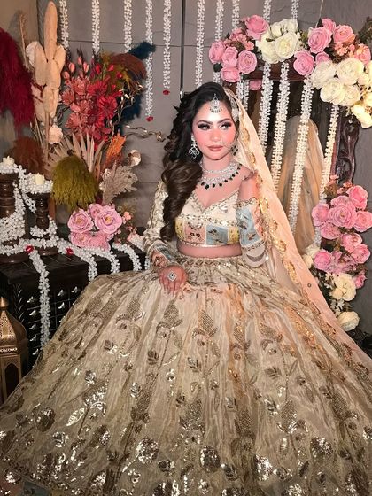 This portrait showcases the complete ensemble, from the intricate lehenga to the elegant dupatta drape and the makeup that brings it all together.