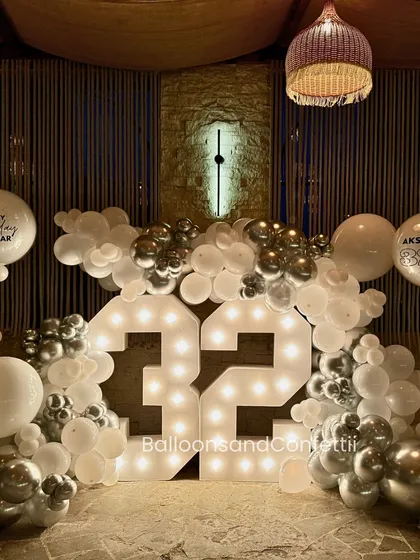 If my 32nd doesn't look like this, I don't want it. A gorgeous, rustic-chic setup with marquee numbers and a white and silver balloon cloud.