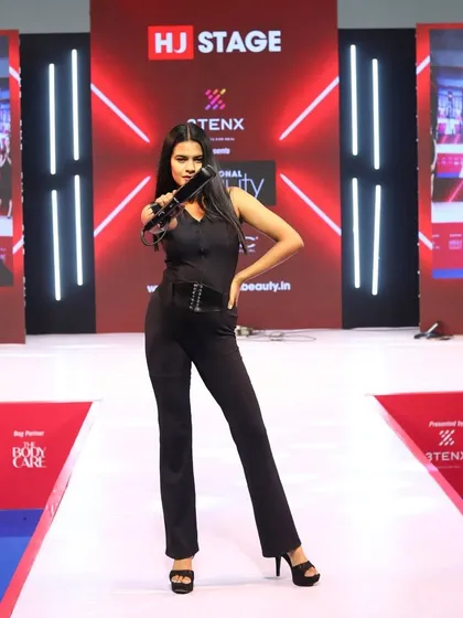 A model showcasing a finished look on the Artisto stage. These shows are all about pushing creative boundaries and inspiring other stylists.