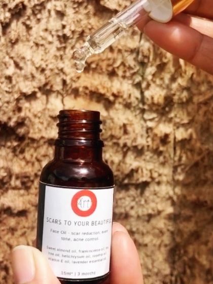 A single drop of the "Scars to Your Beautiful" face oil. This potent serum is perfect for spot correction or for use with a guasha or face roller.