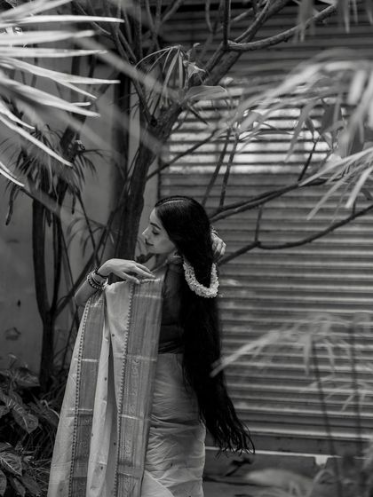 A black and white shot showing the texture and drape of the saree and my hair.