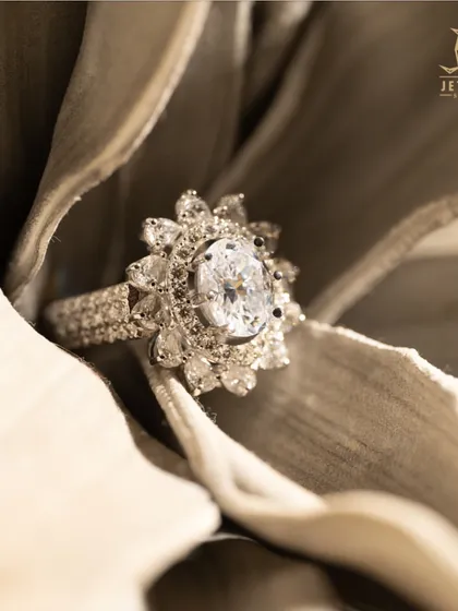 The timeless beauty of an oval diamond, enhanced by a floral-inspired halo setting. I designed this ring to feel both classic and romantic, a perfect symbol of everlasting love, captured in a high-quality, brilliant-cut diamond.