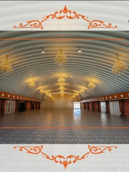 The unique arched ceiling of one of our halls at Maanikya, adorned with elegant chandeliers. This space offers a distinct architectural feel for a memorable event.