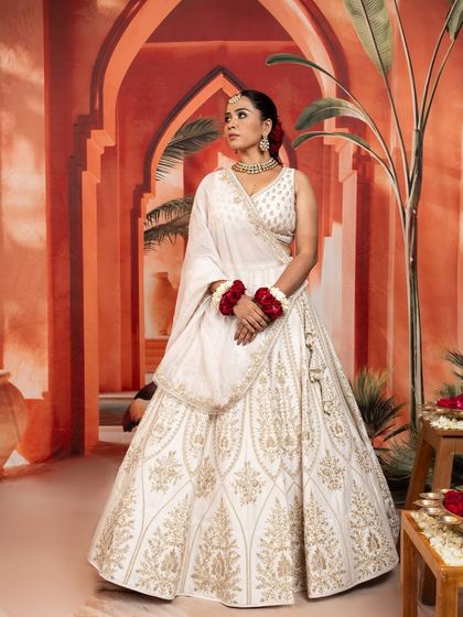 This selection showcases the breadth of my bridal and couture curation. It includes a variety of lehengas, gowns, and sets in different colors and styles, from traditional reds by Anupraas to modern ivories by Mirroir and Varun Chakkilam, ensuring every bride finds her perfect look.