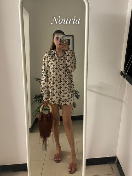 A mirror selfie of a printed long-sleeve co-ord set. The pattern is fun and the silhouette is super comfortable for a casual day out.