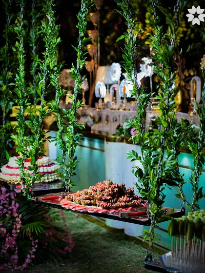 Another view of the 'Gardens of Europe' themed dessert display in Indore. The hanging swings create a sense of motion and wonder, elevating the entire dining experience.