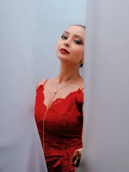A different angle from the same shoot, with the model looking directly at the camera, creating a powerful and alluring portrait.