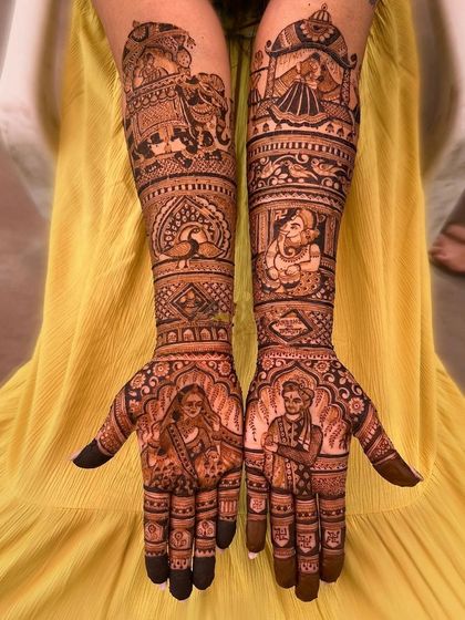 A stunning bride and groom portrait, with the groom in a turban and the bride in her veil. The design also includes Ganesha and elephant motifs.