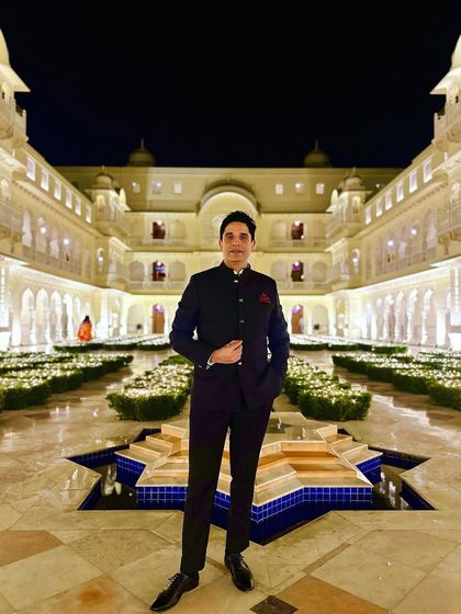 Dressed in a classic bandhgala in a beautifully lit courtyard in Jaipur. This look is perfect for a royal-themed sangeet or reception.