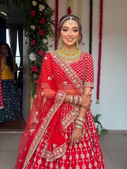 A full-length view of the bride. The open, wavy hairstyle is a great choice for a modern bride who wants to feel comfortable yet look stunning.