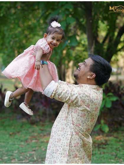 Another angle of the father and daughter. The genuine happiness in this photo is what family portraits are all about.
