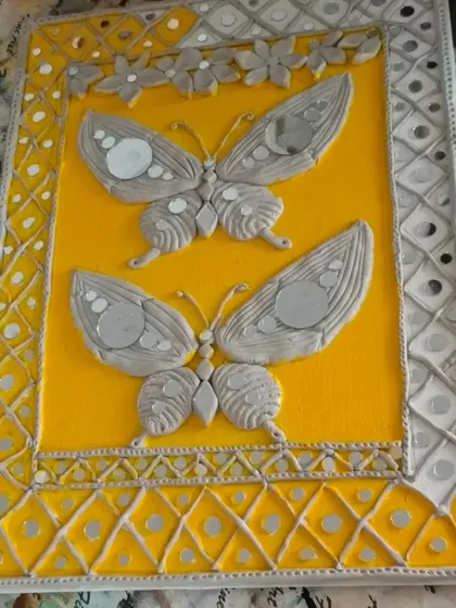 This completed Lippan art panel showcases the beautiful combination of textured clay and reflective mirror work. In our classes, you'll create your own decorative piece from start to finish.