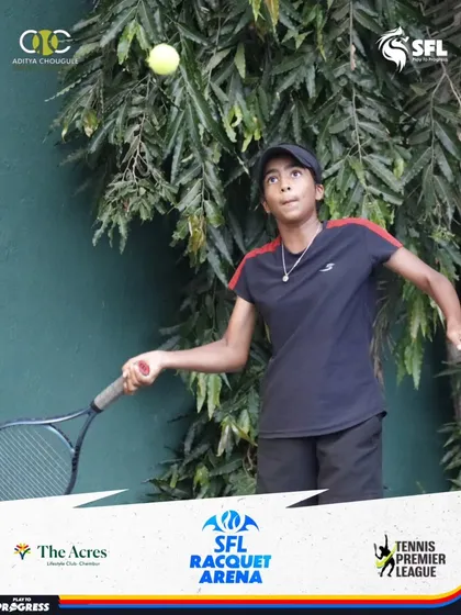 A junior player lunges for a forehand shot, showcasing his agility and determination to win the point.