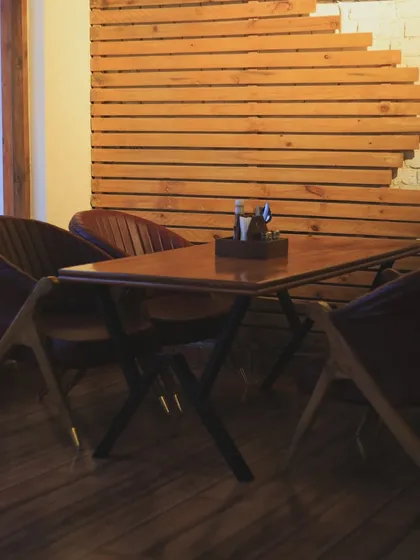 A simple and clean setup in our indoor section, perfect for a quiet meal or a productive work session.