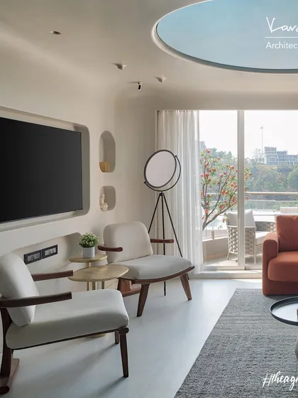 The living room of the Agra Fort Project was designed to maximize the awesome view of the spiritual valley. The space is filled with natural light and features soft, organic curves and a calming, neutral palette.