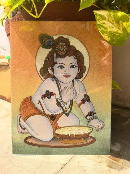 This painting of Bal Gopal, or Baby Krishna, is filled with a sense of innocent joy. I used bright, sparkling gemstones to bring his playful character to life as he enjoys his bowl of butter. It is a piece designed to invite happiness and positive energy into any space, especially a family home or prayer room.