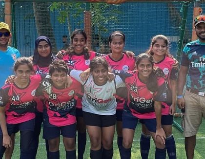 The coaching staff with our girls' team, showcasing the supportive and expert guidance they provide.