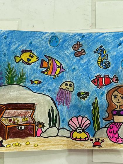 An imaginative underwater scene created by one of my students, complete with a mermaid, a treasure chest, and lots of colourful sea creatures.