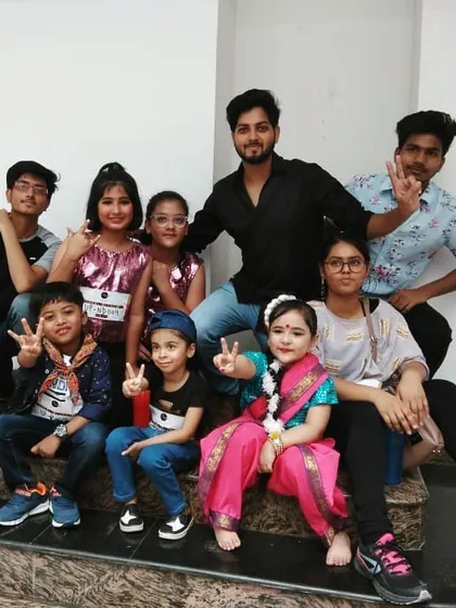My group of young performers, ranging from little kids to teenagers, waiting backstage. I work with all age groups, tailoring the choreography to be age-appropriate and fun.