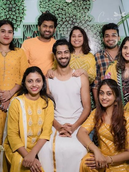 A happy group portrait capturing the energy of the day. The backdrop of our custom decor ensures every photo is picture-perfect.