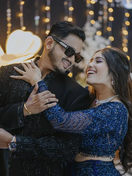 Laughter and love. This candid shot captures the joy of the celebration, with the bride looking effortlessly glamorous.