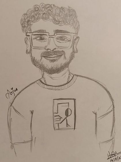 A close-up of a hand-drawn caricature of Arjun, done in my signature style at a cafe event.