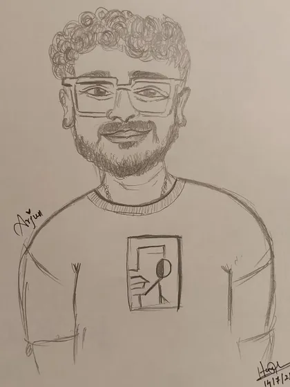 A close-up of a hand-drawn caricature of Arjun, done in my signature style at a cafe event.