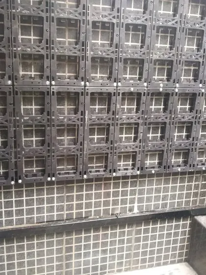 A closer look at the vertical garden panel system being installed on a wall. This durable structure is the foundation for a long-lasting and healthy living wall.