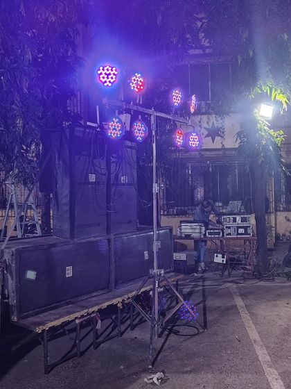 The Kojagiri event setup at night, with the colorful LED lights creating a festive mood. I can program the lights to match the music and the vibe of the event.