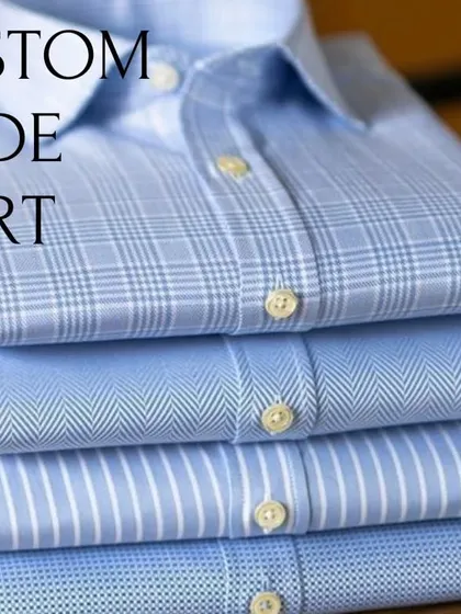 Beyond ethnic wear, we specialize in bespoke casual shirts. This image shows a stack of custom-made shirts in various patterns, representing the range of high-quality fabrics and styles we offer with our guaranteed fitting service.