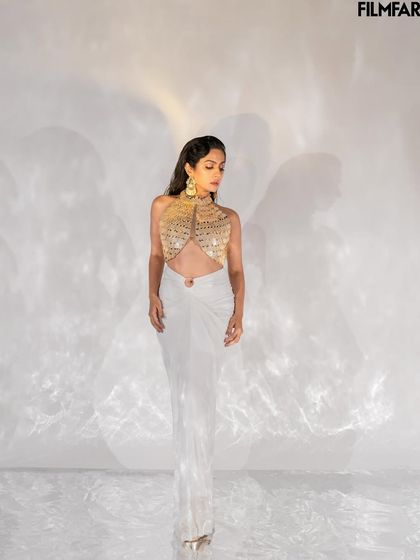 This full-length shot for Filmfare showcases the entire ensemble against a clean, high-key background. The lighting setup was designed to create interesting shadow play while keeping the focus on the subject.