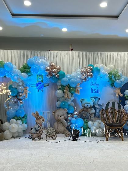 A full stage view of the naming ceremony decoration under blue lighting, creating a dreamy effect.